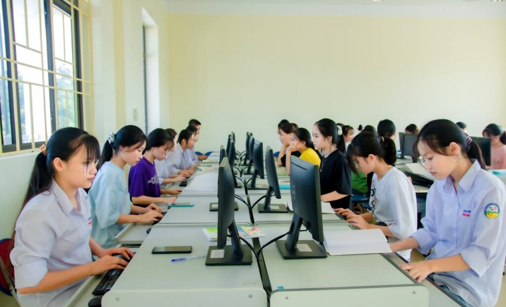 People Sitting on Chairs while using Computers